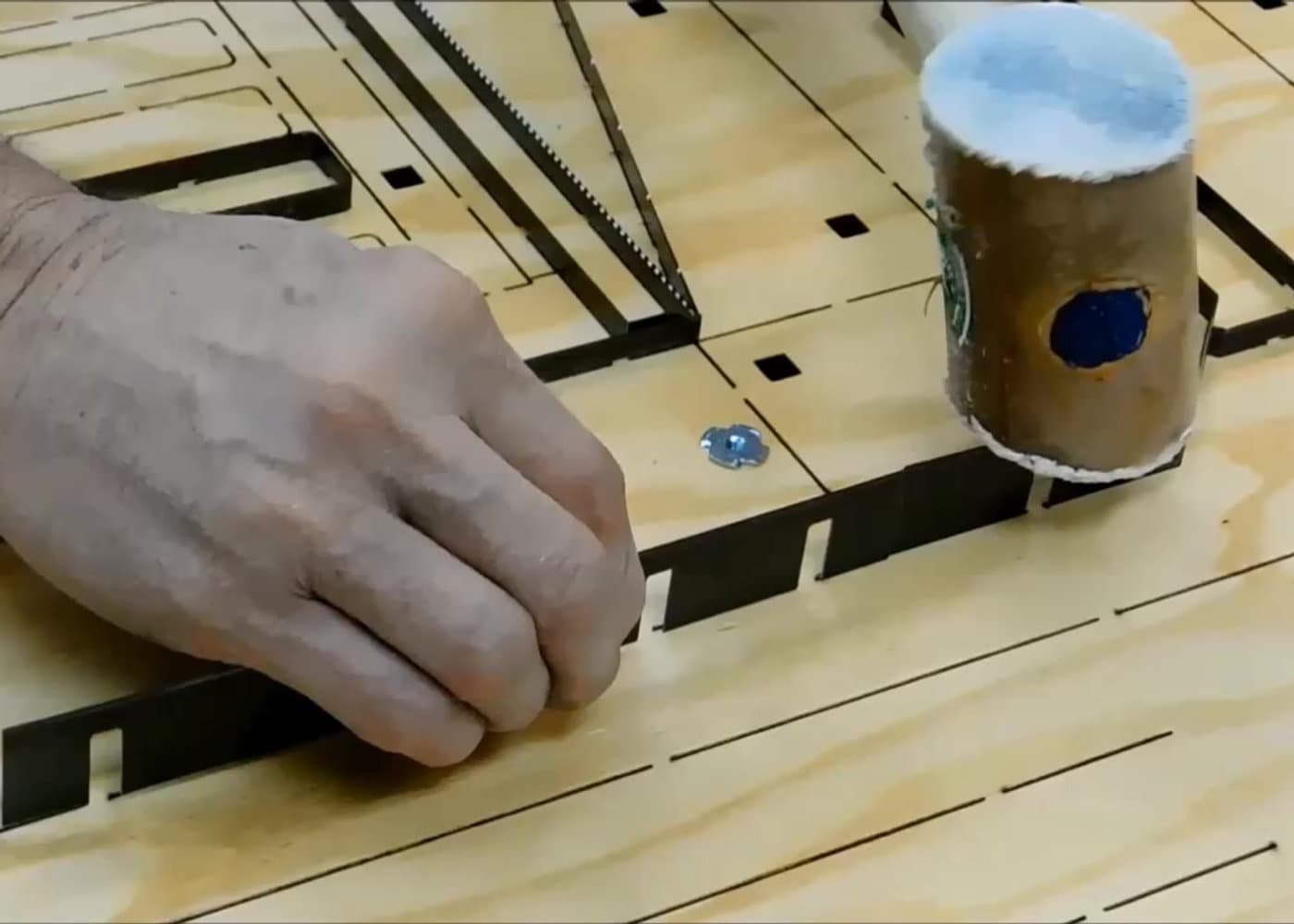 Craftsman fitting a counterplate by hand